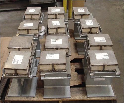 Slide Plate Assemblies with Marinite Insulation and Vibration Pads
