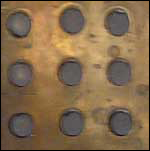 Image of a close up view of a bronze slide plate