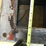 Old rusted rectangular expansion joint